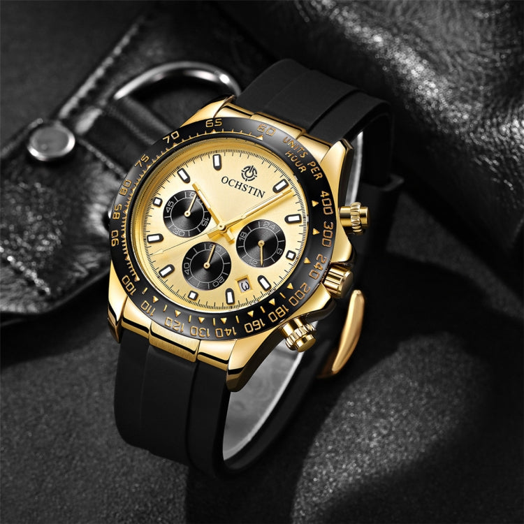 Gold-tone quartz chronograph with black silicone band, white dial and bezel with markers
