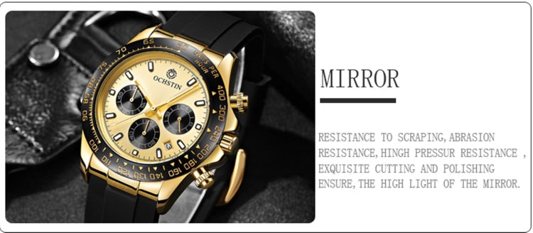 Gold-tone quartz watch with black silicone strap, close-up view of subdials