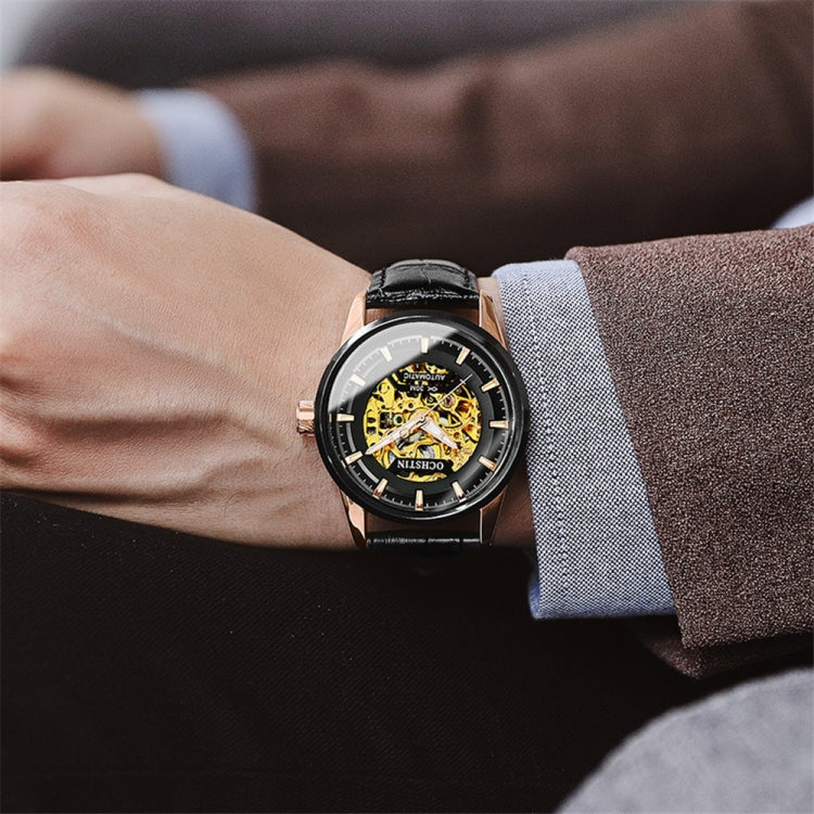 Ochstin mechanical watch on wrist with black leather strap and open skeleton dial