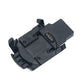 Black Garmin charging cradle with exposed gold charging contacts and spring clips