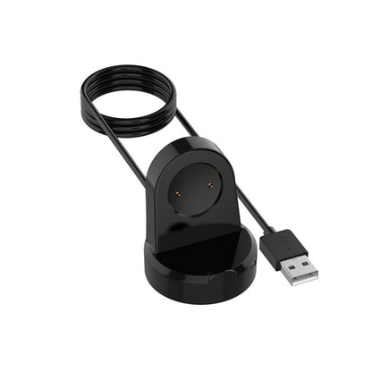 Black watch charging stand with coiled cable and USB connector base.