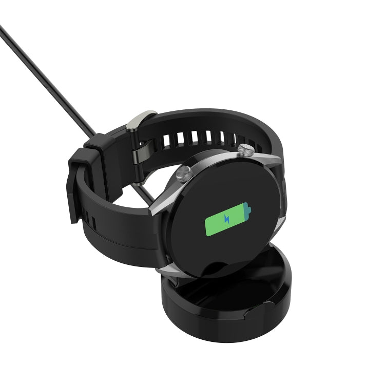 Black watch charging dock with strap holder, open cradle detail.