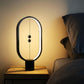 Black oval LED night light with warm glow and three hanging bulb LEDs on base