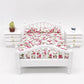 Front view of white mini doll bed with floral bedding and side rail posts