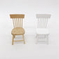 Miniature dining chairs in wood and white, slatted backs and rounded seats.