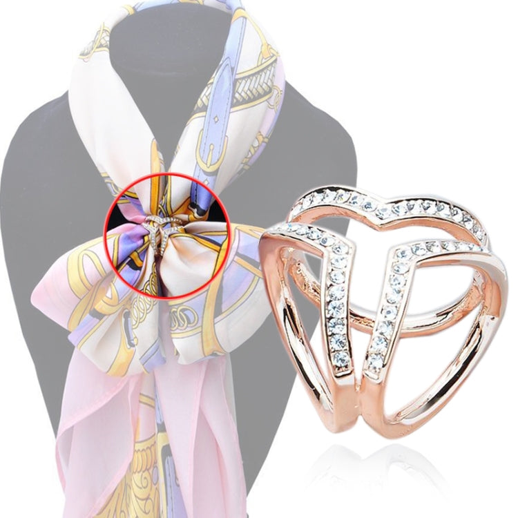 Silk scarf knot secured by crystal brooch, heart buckle style