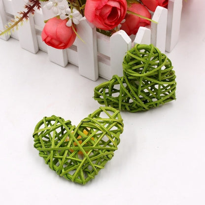 Green rattan heart ornaments, two woven straw hearts with crisscross lattice.