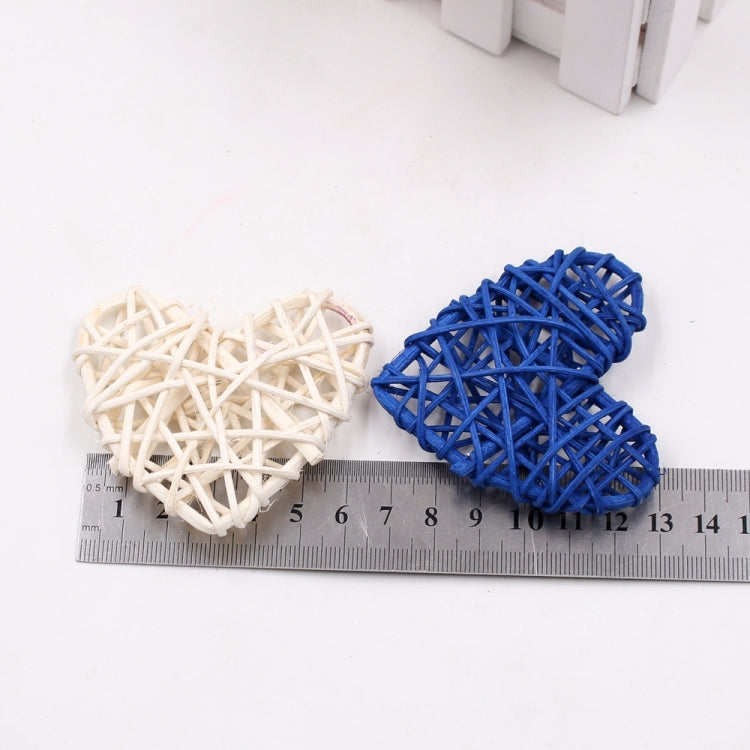 White and dark blue woven rattan heart ornaments, paired crisscross straw hearts.