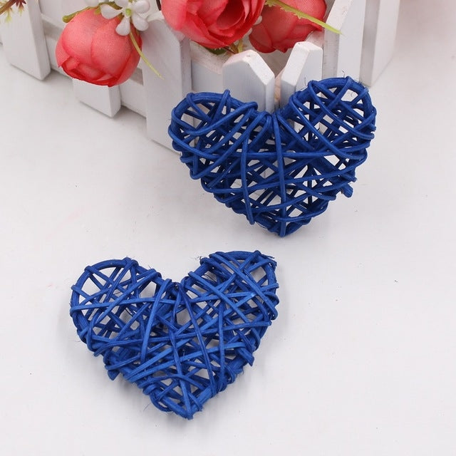 Dark blue rattan heart ornaments, two woven straw hearts with crisscross lattice.