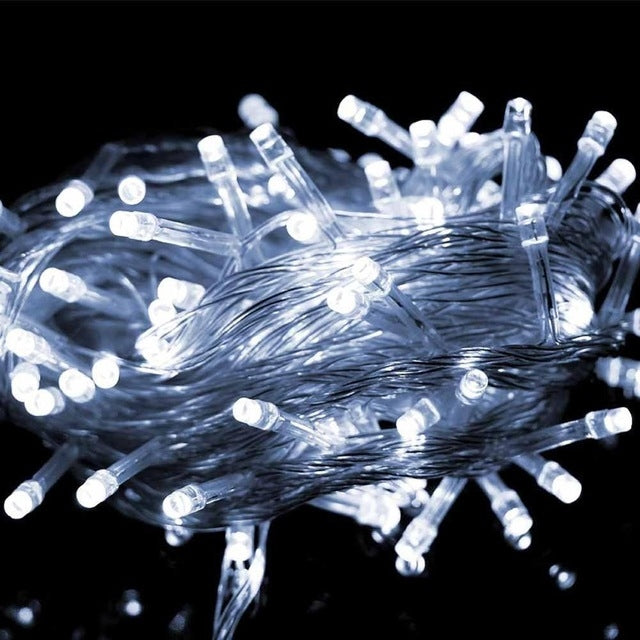 50M LED string lights with white bulbs on transparent wire, glowing decorative garland