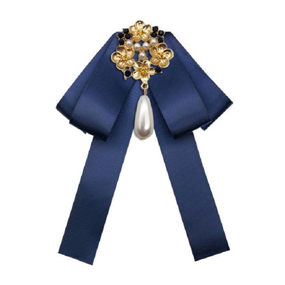 Navy satin bow with gold pearl and rhinestone floral brooch, dangling teardrop pearl
