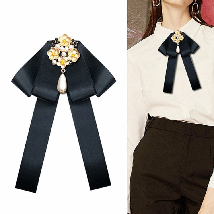 Black fabric bow with gold pearl and rhinestone floral brooch, hanging teardrop pearl