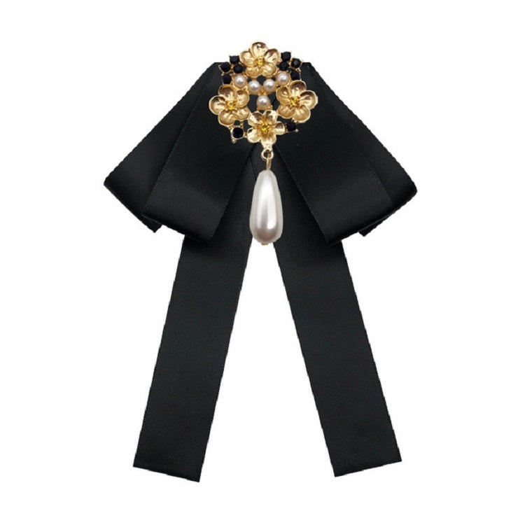 Black fabric bow with gold pearl and rhinestone floral brooch, dangling teardrop pearl
