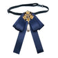 Navy satin bow brooch with pearl rhinestone floral centerpiece and teardrop pearl strap