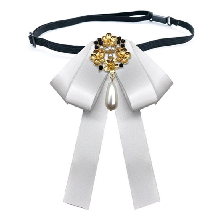 White ribbon bow tie belt with gold pearl cross and teardrop pendant