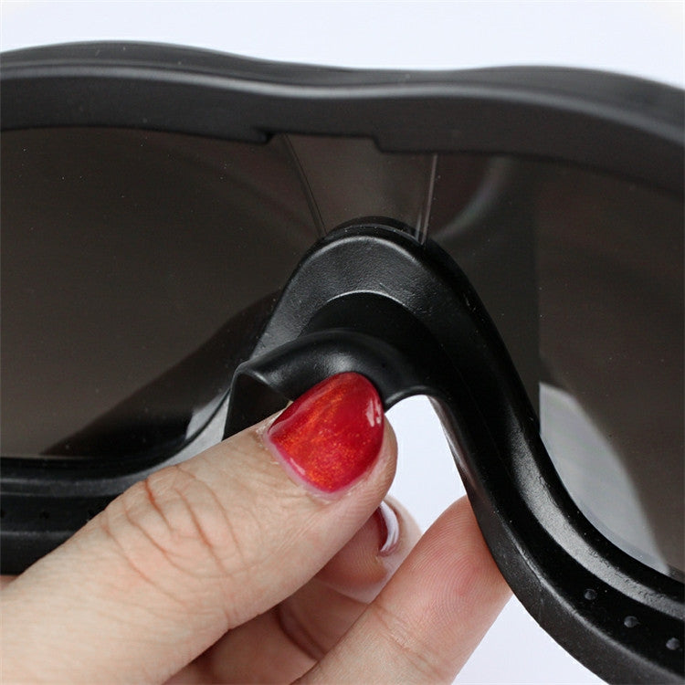 Hand adjusting black pet goggles side strap holder with vented lens frame.