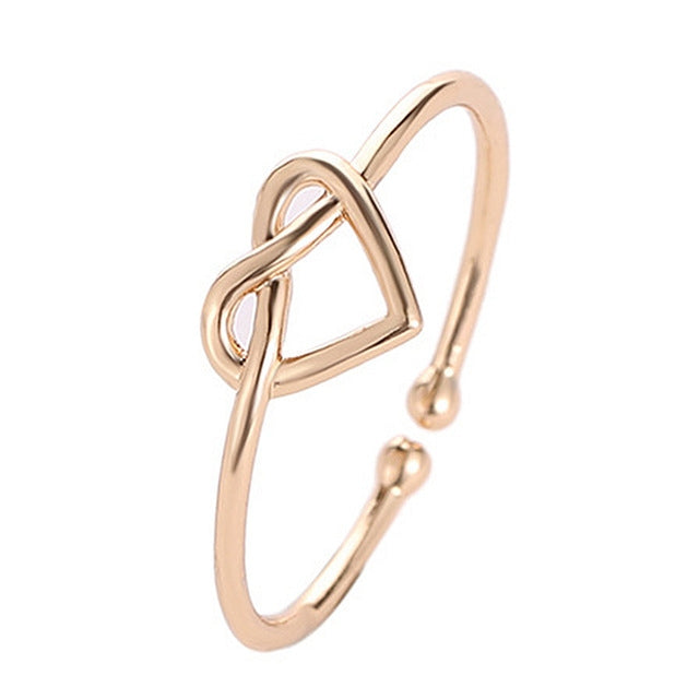 Gold adjustable heart hollow ring with open loop band and heart cutout