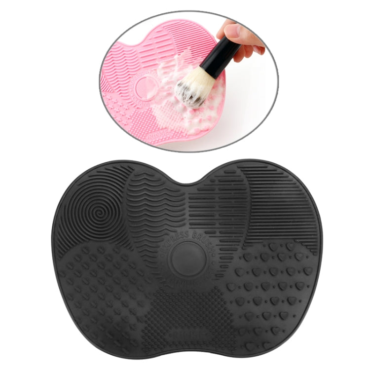 Black silicone heart brush cleaning mat with textured scrubbing surface