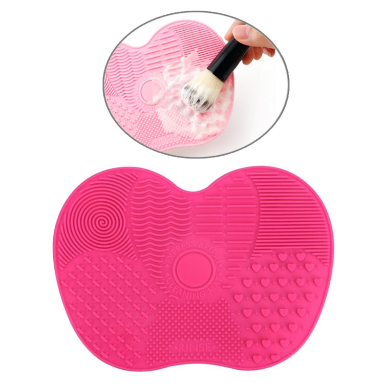 Pink silicone heart brush cleaning mat with textured cleaning zones for bristles