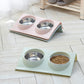 Set of slope pet bowl stands with stainless inserts in pink and mint colors