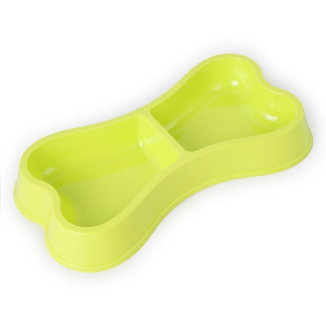 Light green bone-shaped double dog bowl in plastic with two divided feeding compartments