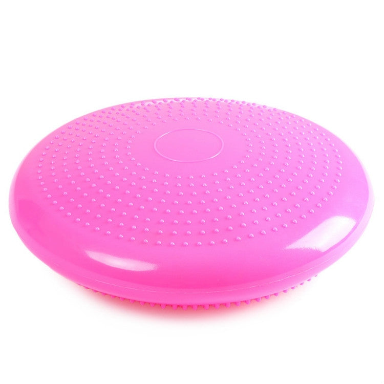 Pink circular massage balance cushion with raised nubs and center air valve