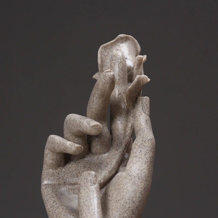 Abstract light-gray hand sculpture with layered palms and small rose head.