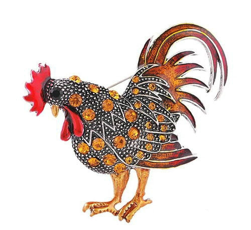 Orange rooster enamel brooch with jeweled dotted body and curled tail feathers