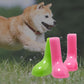 Pair of bright green and pink waterproof dog rain boots with grippy soles