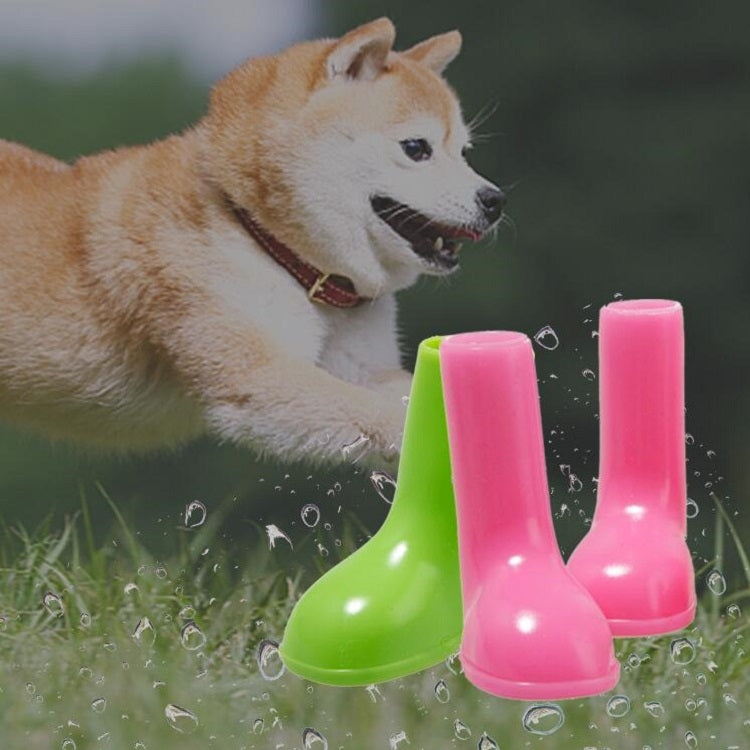 Pair of bright green and pink waterproof dog rain boots with grippy soles