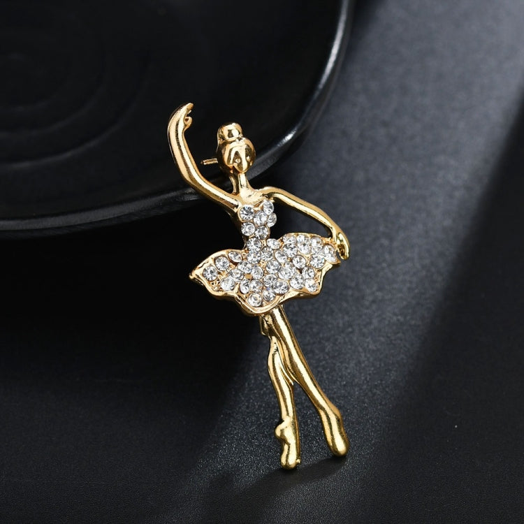 Gold-tone ballerina brooch with crystal tutu, curved pose and raised arms