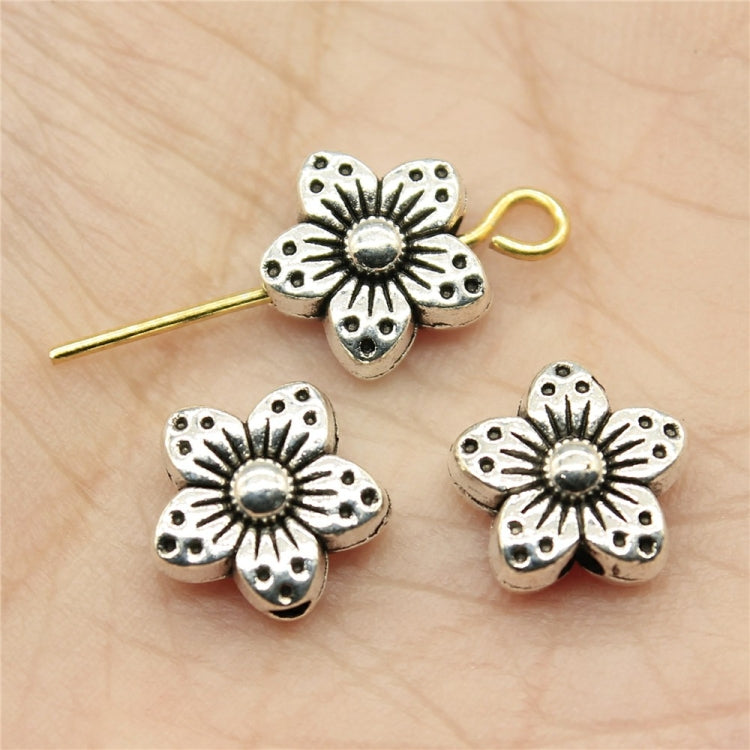 Silver flower charm bead spacers with engraved petals, round center, and small loop top