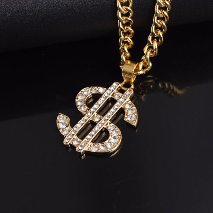 Gold-tone chain with large rhinestone dollar-sign pendant, angled close-up