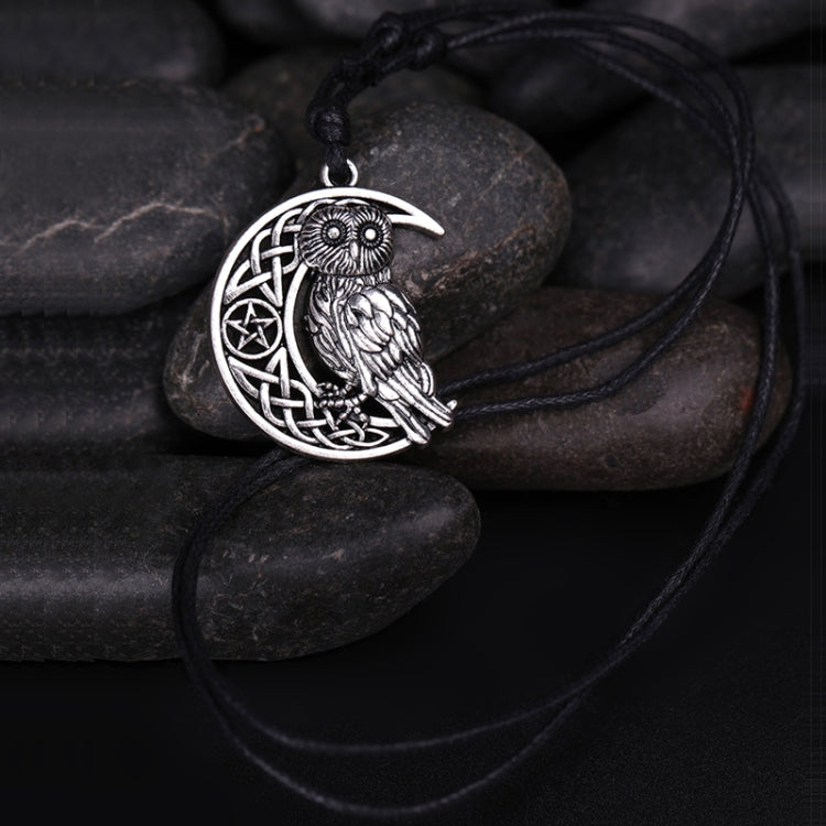 Antique silver owl moon pendant on black cord, circular crescent with knotwork
