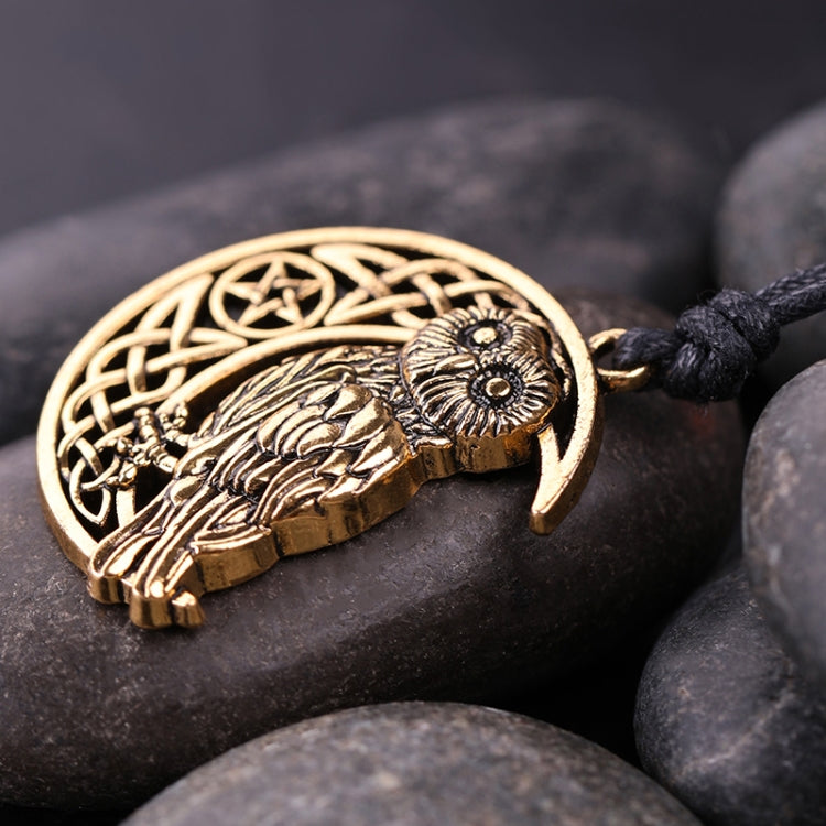 Antique gold owl moon pendant on black cord, crescent with knotwork and feathers