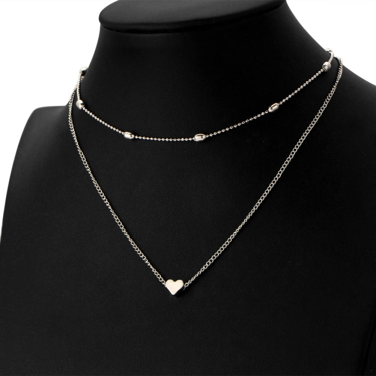 Silver two-chain heart clavicle necklace with round links and small center detail