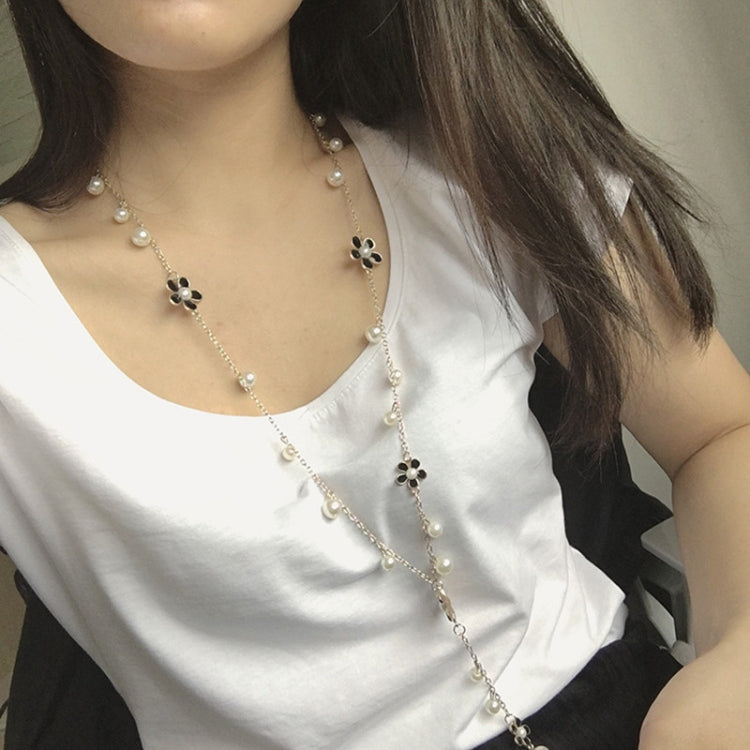 Long pearl bead necklace with five-petal flower charms and pearl tassel drop