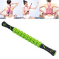 Green and black segmented massage roller stick with cushioned end caps.