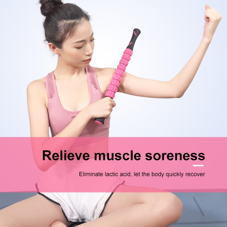 Pink segmented massage roller stick held for muscle massage.