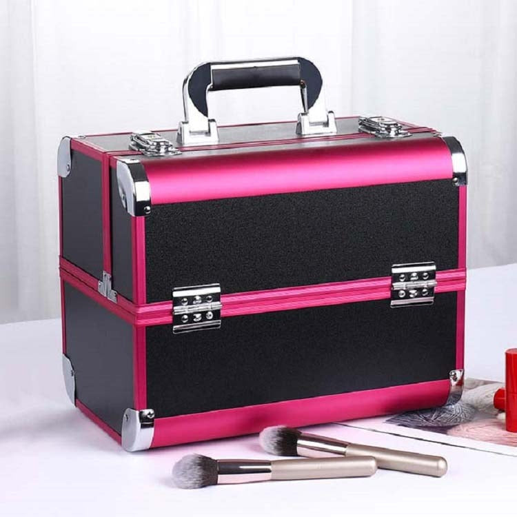 Pink and black makeup toolbox case with silver handle, corner locks, and makeup brushes