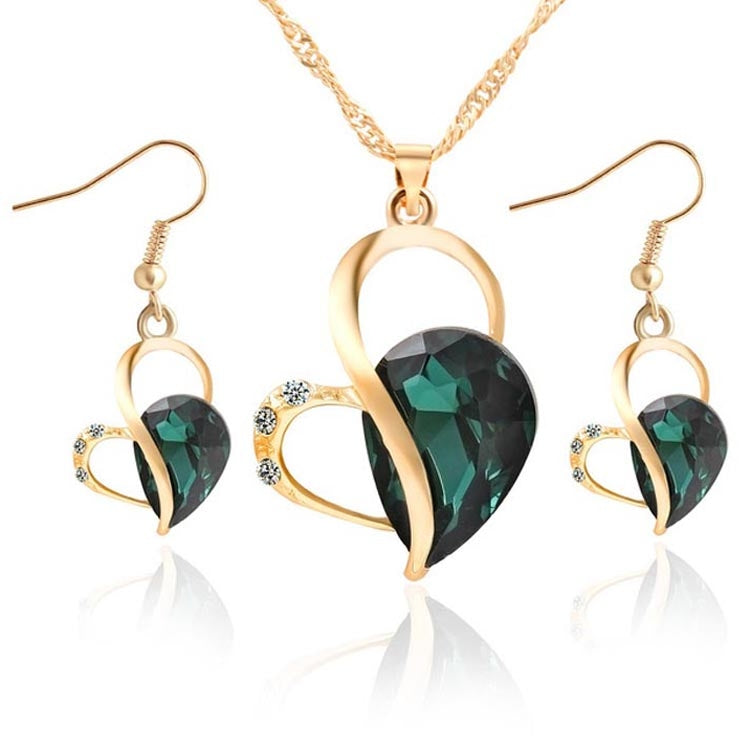 Gold-tone heart crystal pendant necklace set with matching drop earrings, green faceted stone