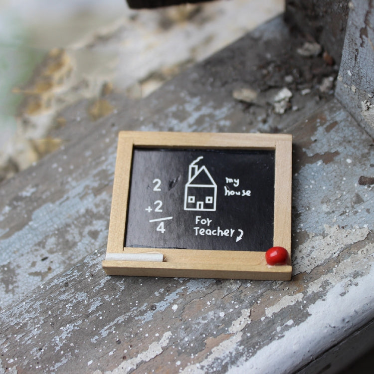 Miniature wooden blackboard with chalk math and “For Teacher?” text, red knob