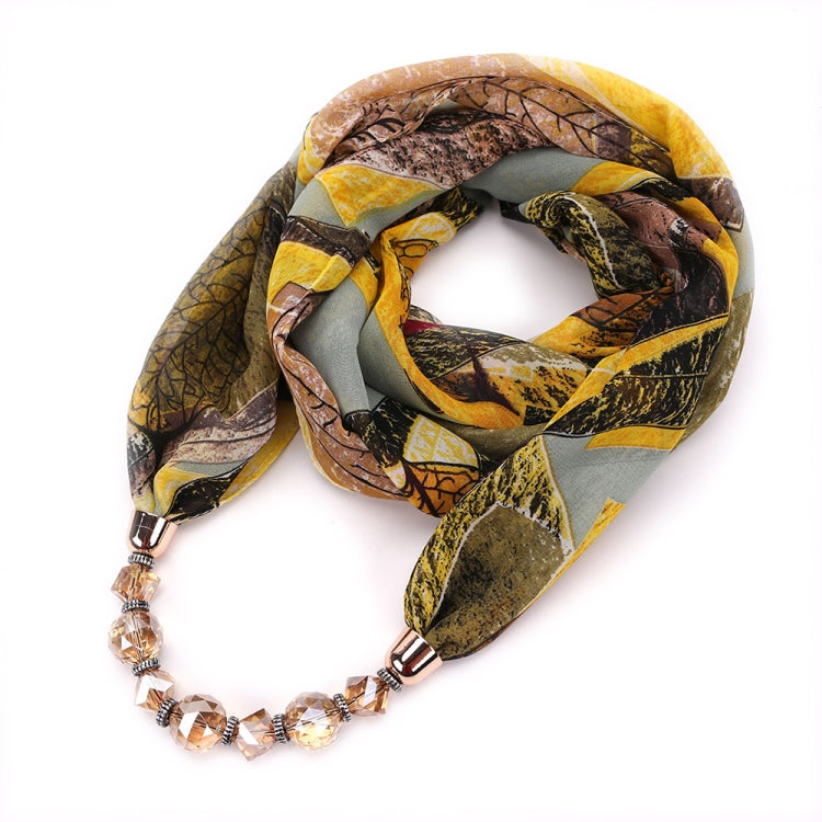 Chiffon scarf with bold yellow and gray print and beaded necklace, geometric