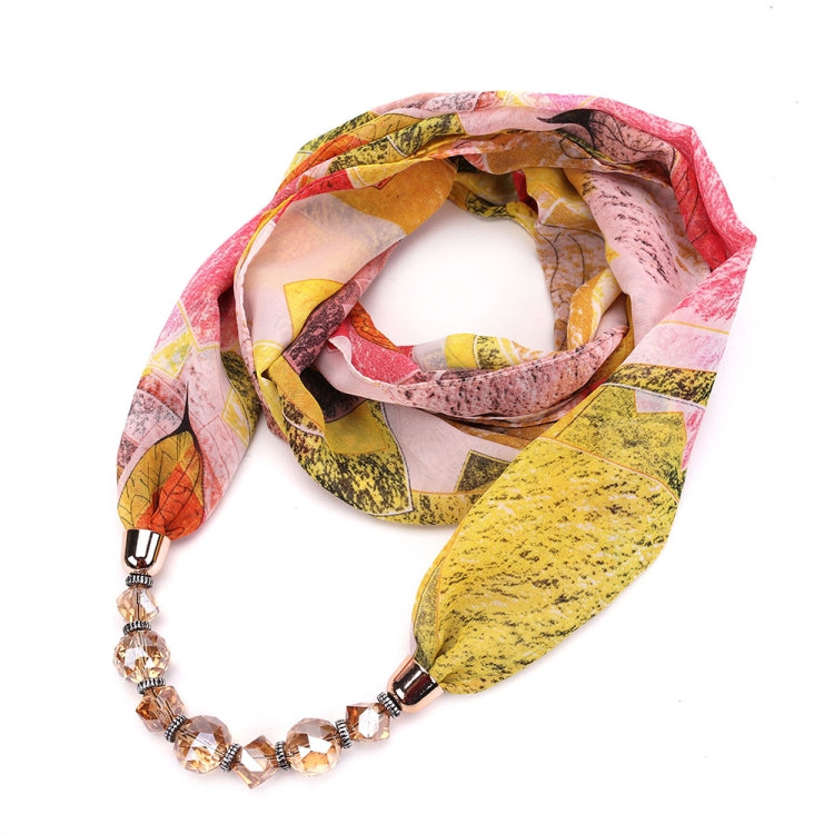 Chiffon scarf with pink, yellow, and gray print and crystal beaded necklace