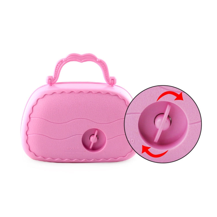 Pink music jewelry box with round key slot and hinged handle