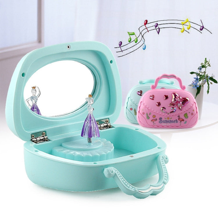 Blue open music jewelry box with ballerina figurine and pink handbag-style box