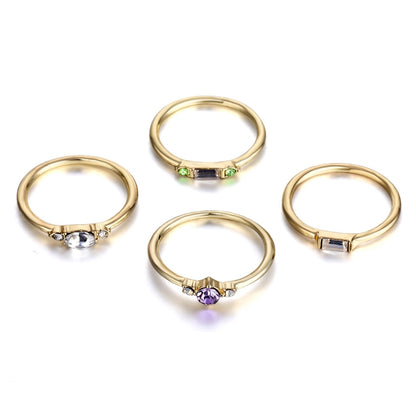 Gold-tone ring set of 4 with multicolor oval and baguette crystal stones, open bands