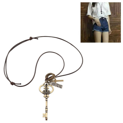 Crown key pendant necklace with bronze-tone heart charm and two keys on cord