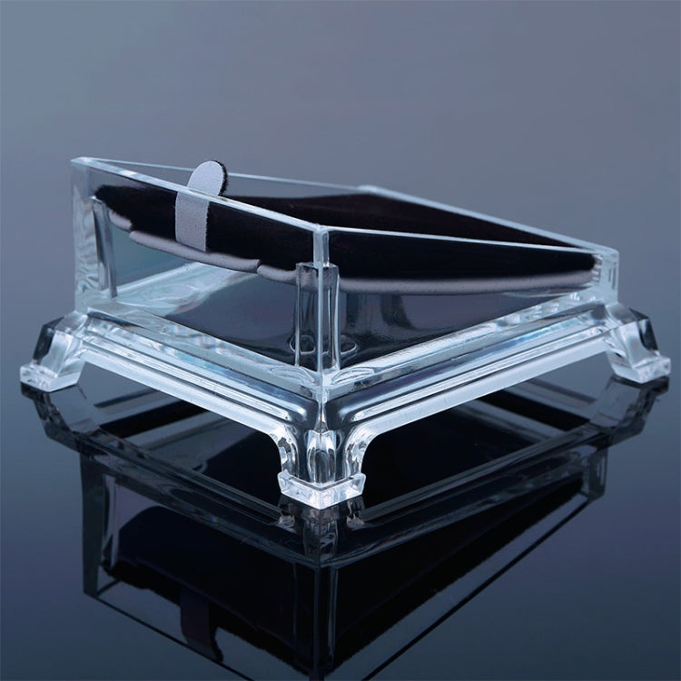 Transparent acrylic jewelry tray displaying a bracelet on a clear base