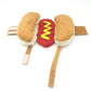 Hot dog style pet costume flat lay, beige bun ends with red center and yellow zigzag